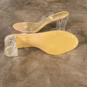 Nude colored lucite block heels with clear straps